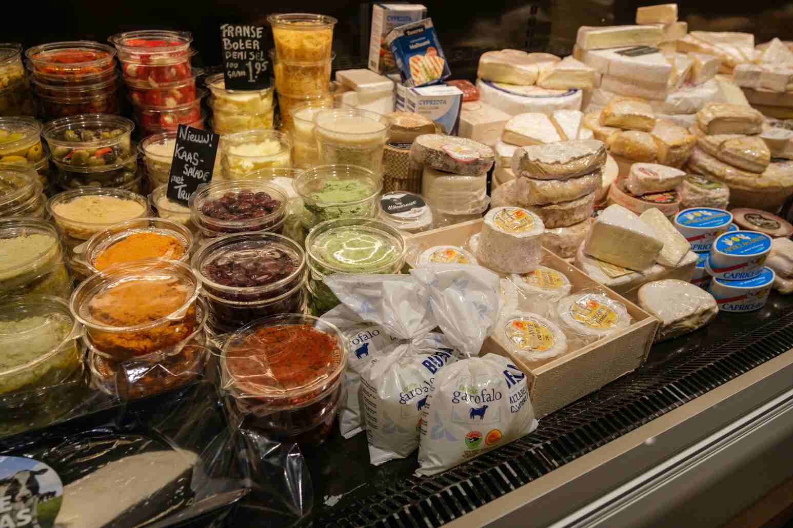 Fresh cheeses and dips on display